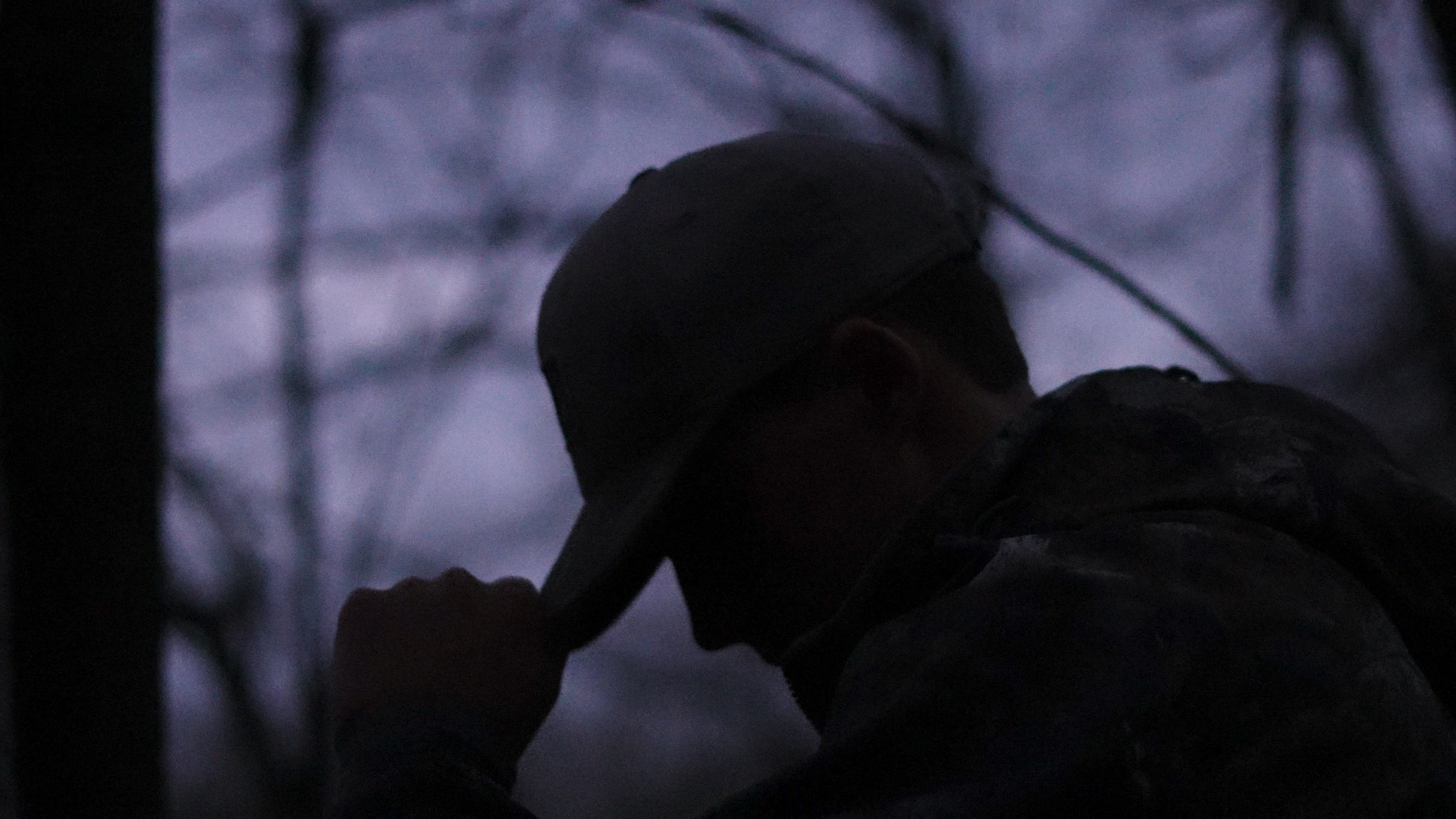 Silhouette of a hunter in low morning light