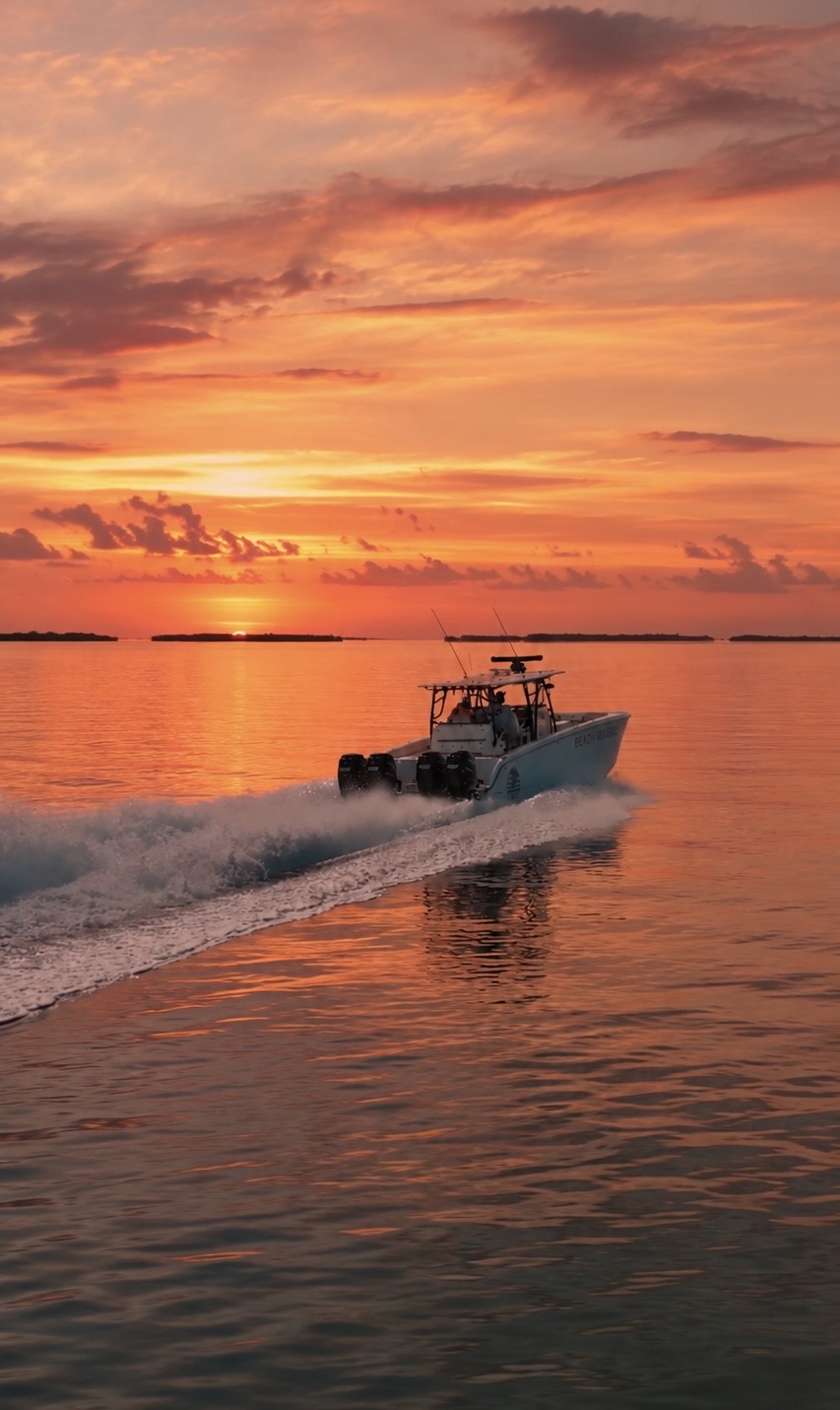 Fishing boat running across calm water